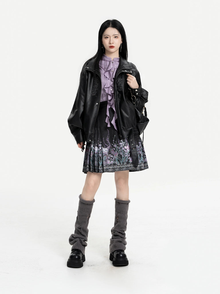 Person wearing a black leather jacket, purple top, and tie-dye skirt on a white background
